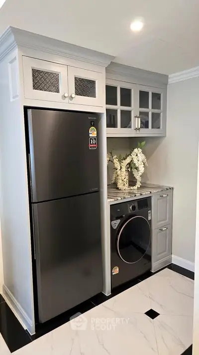 Modern kitchen with sleek appliances and elegant cabinetry
