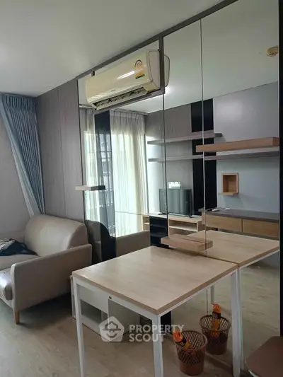 Modern living room with sleek furniture and air conditioning in a stylish apartment.