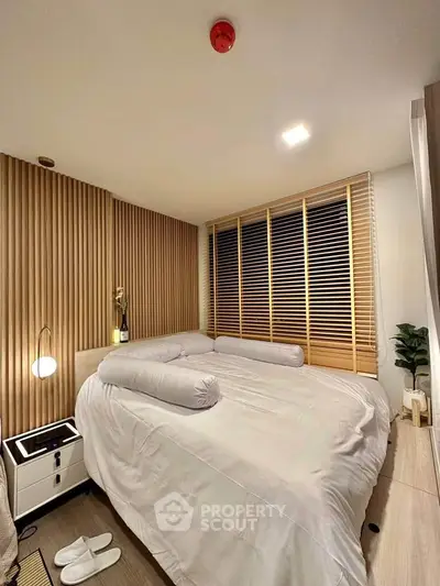 Cozy bedroom with modern wooden accents and ambient lighting