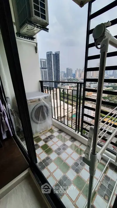 Charming balcony with city view, featuring a washing machine and modern railing design.