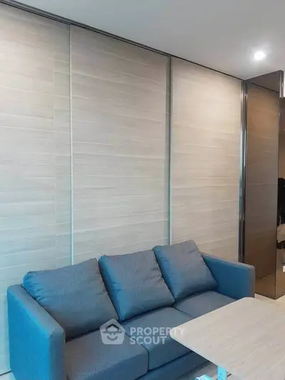 Modern living room with sleek sofa and wooden sliding doors
