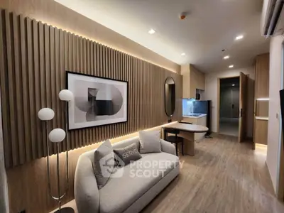 Modern living room with stylish decor and cozy sofa in open layout.