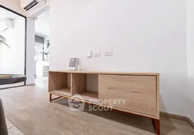 Modern minimalist living room with wooden furniture and sleek flooring