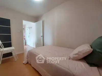 Cozy bedroom with single bed and minimalist decor