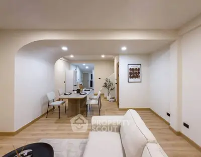 Spacious modern living room with elegant dining area and minimalist decor