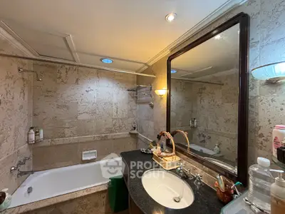 Luxurious bathroom with elegant marble walls and modern fixtures