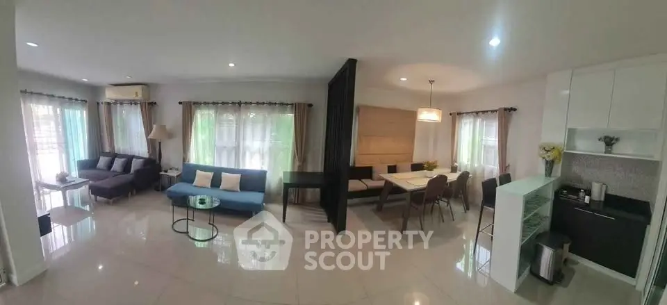 Spacious modern living room with open layout and elegant dining area