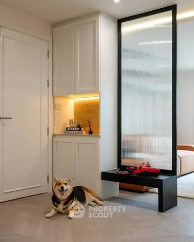 Modern living room with stylish decor and a happy dog, showcasing a cozy and inviting atmosphere.