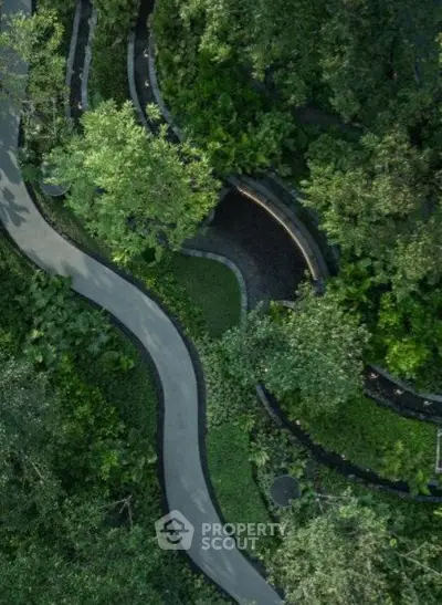 Lush garden pathway with winding design and abundant greenery