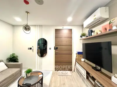 Modern living room with stylish decor, wall-mounted TV, and air conditioning unit, perfect for cozy urban living.