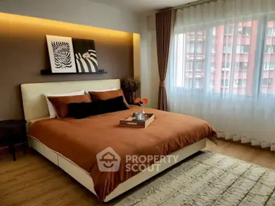 Modern bedroom with stylish decor and large window view