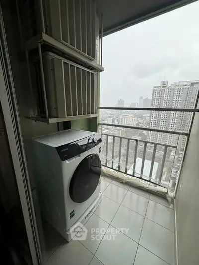 High-rise apartment balcony with washing machine and city view