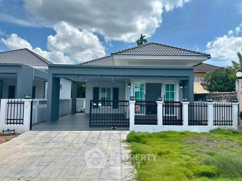 Charming single-story home with modern design and spacious driveway, perfect for family living.