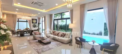 Luxurious open living room with pool view and elegant decor