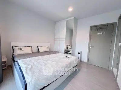 Modern bedroom with sleek design and ample storage space