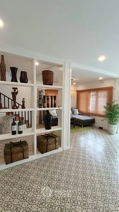 Stylish living room with decorative shelving and cozy seating area