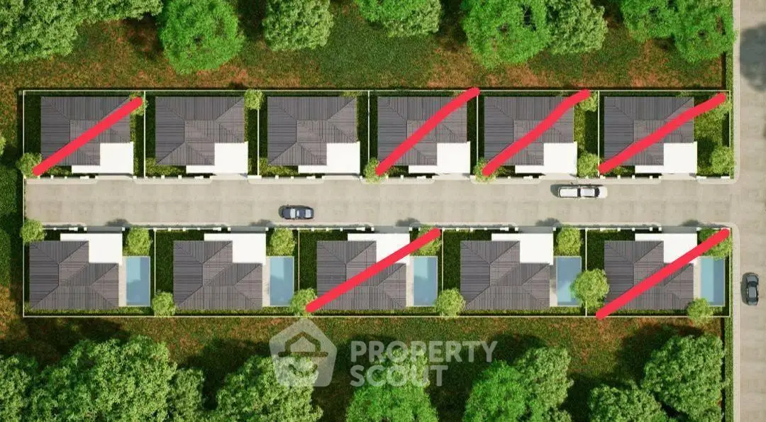 Aerial view of modern residential complex with lush greenery and private driveways.