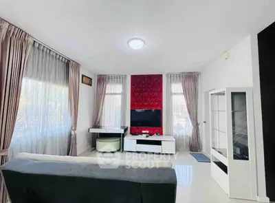 Spacious modern living room with large windows and stylish decor