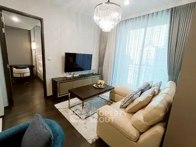 Luxurious living room with elegant chandelier and modern decor in high-rise apartment.