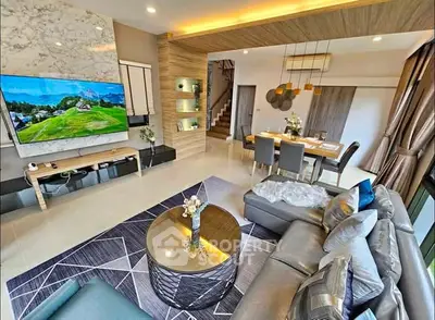 Luxurious modern living room with stylish decor and open dining area, perfect for entertaining.