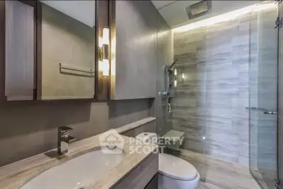 Modern bathroom with sleek design and glass shower enclosure