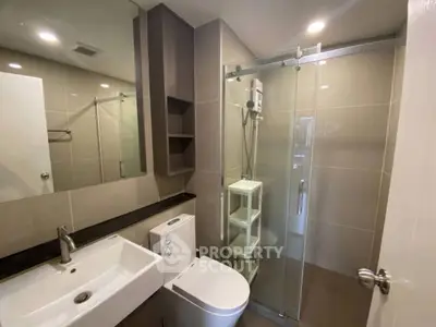Modern bathroom with glass shower and sleek fixtures