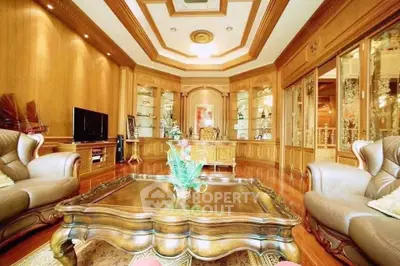 Luxurious living room with elegant wooden decor and plush seating