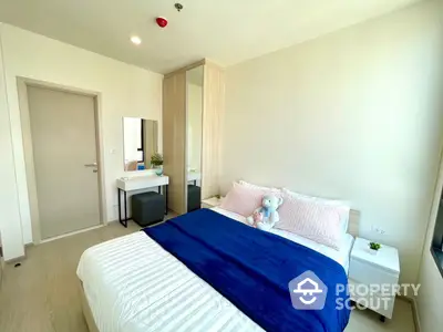 Bright and airy bedroom with a plush queen-sized bed, crisp white walls, and modern furnishings, perfect for restful nights in a contemporary home.