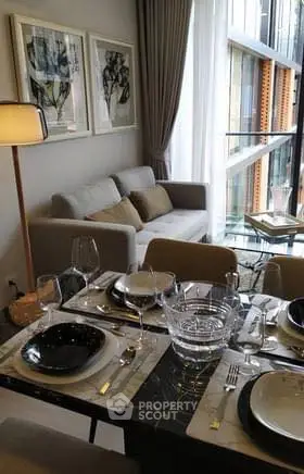 Elegant dining area with modern decor and large window view