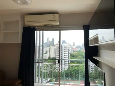 Modern apartment with balcony offering stunning city skyline view