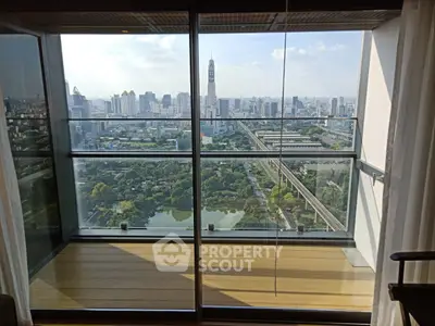 Stunning high-rise balcony with panoramic city view, perfect for urban living enthusiasts.