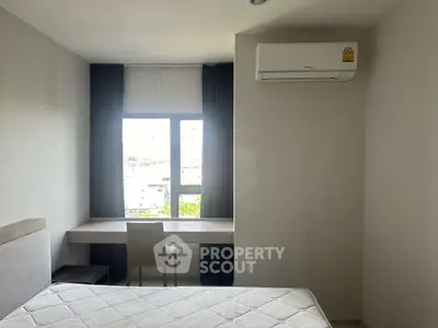 Modern bedroom with large window and air conditioning unit