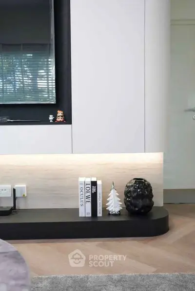 Modern living room with sleek decor and stylish shelving