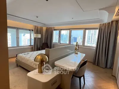 Luxurious bedroom with city view, elegant decor, and modern furnishings in high-rise apartment.