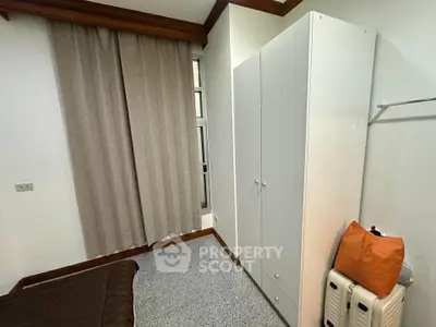 Cozy bedroom with modern wardrobe and neutral decor