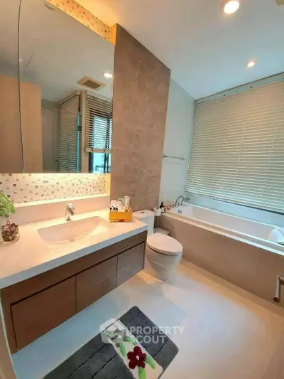 Luxurious bathroom with modern fixtures and elegant bathtub in a stylish home.