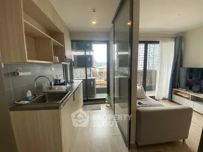 Modern open-layout kitchen and living room with city view