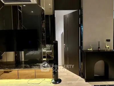 Luxurious living room with modern decor and sleek TV setup