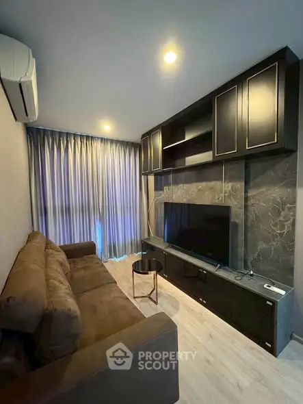 Modern living room with sleek entertainment center and cozy sofa