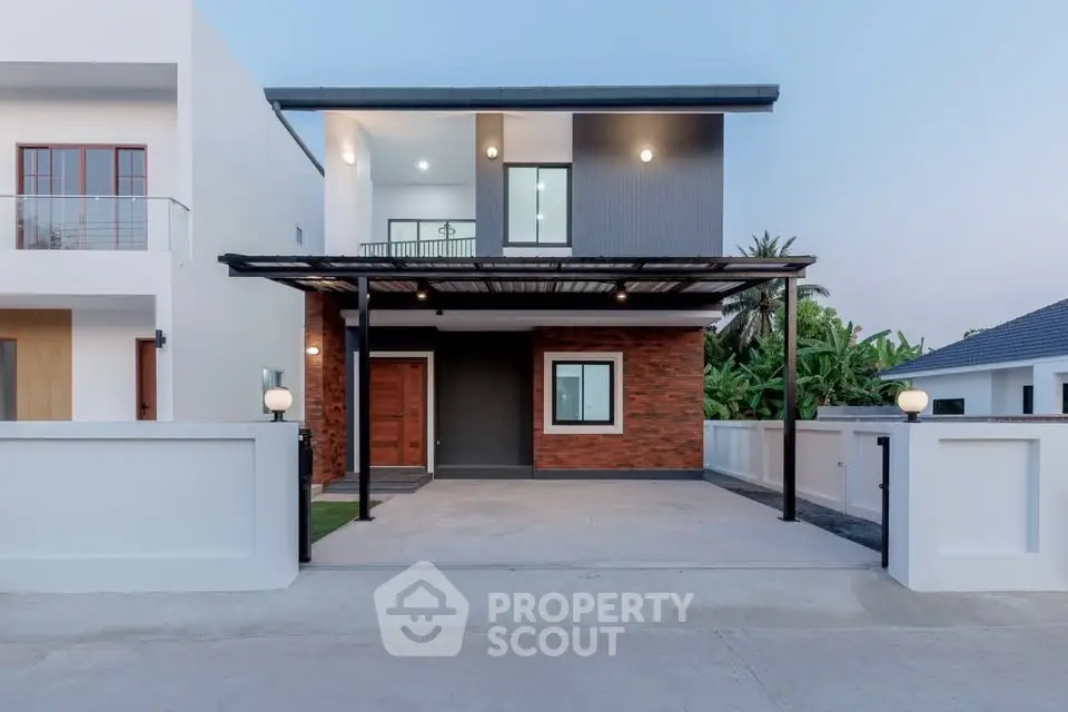 Modern two-story house with sleek design and spacious driveway in a serene neighborhood.
