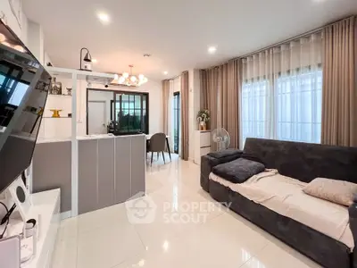 Modern living room with sleek design and open kitchen layout