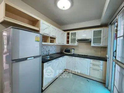 Modern kitchen with sleek cabinetry and stainless steel appliances