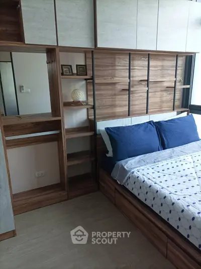 Modern bedroom with stylish wooden accents and built-in storage solutions