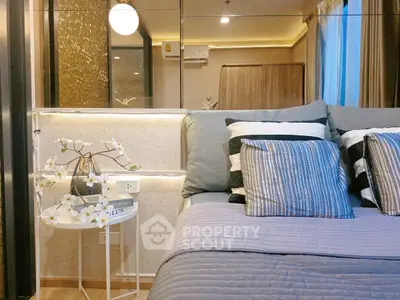 Luxurious bedroom with modern decor and ambient lighting, featuring a cozy bed and elegant side table.