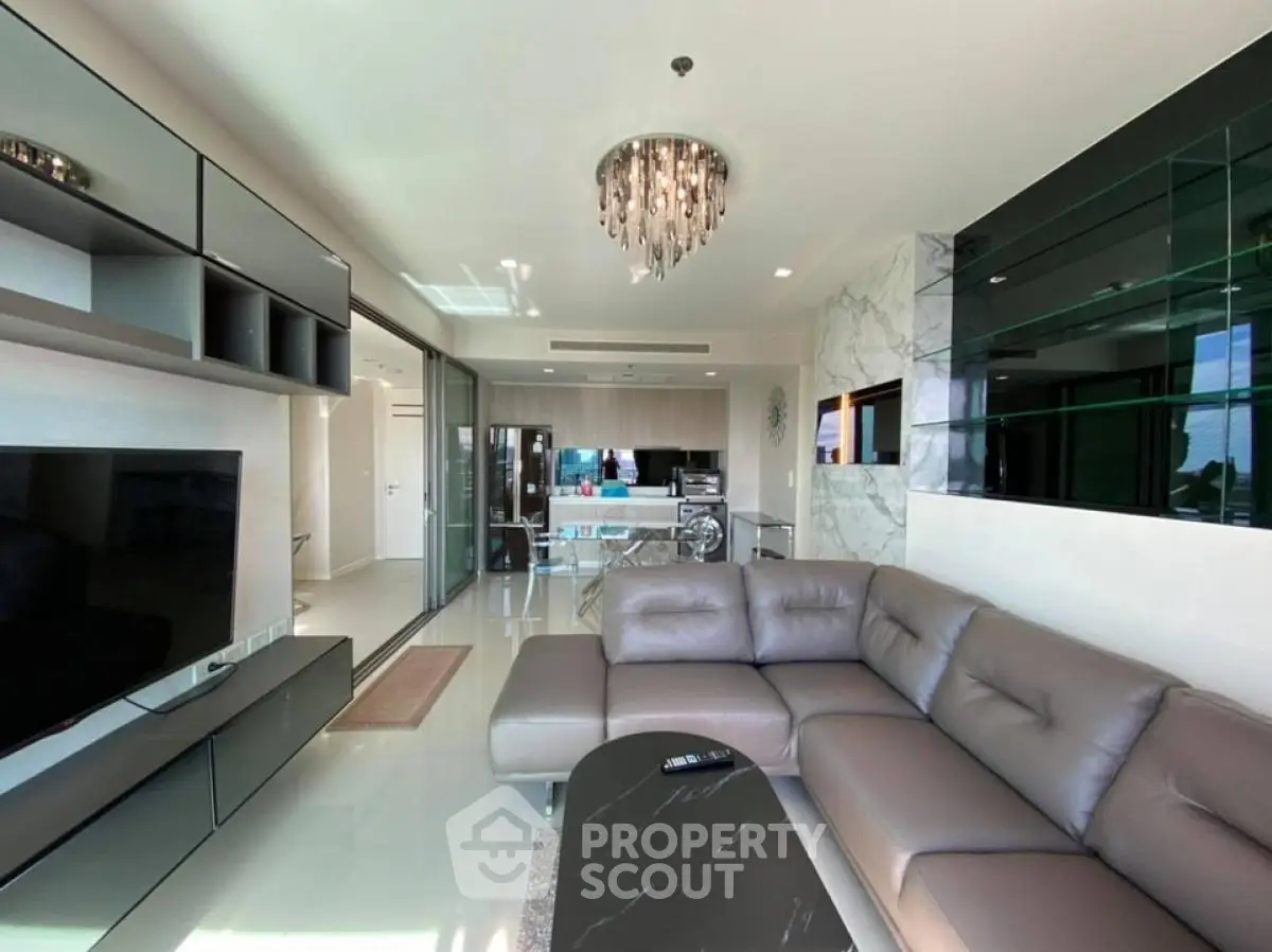 Luxurious modern living room with sleek furniture and elegant chandelier