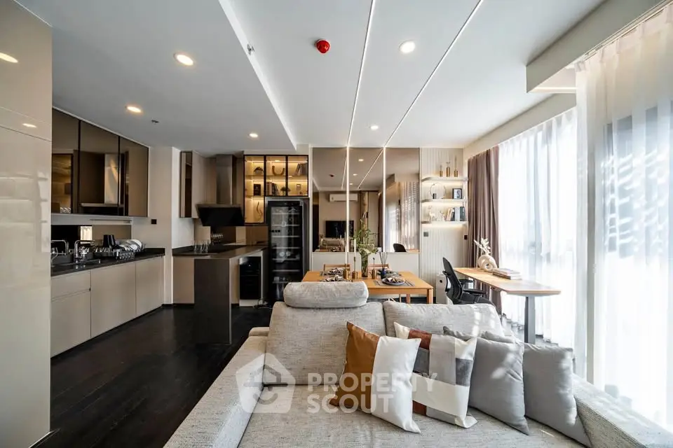 Spacious modern living room with open kitchen and elegant decor