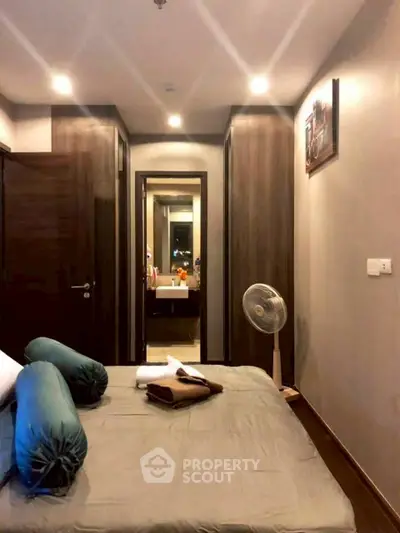 Cozy bedroom with modern decor and ensuite bathroom view