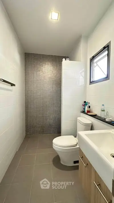Modern bathroom with sleek design and neutral tones