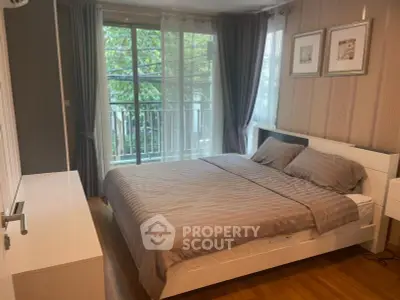 Modern bedroom with large window and stylish decor