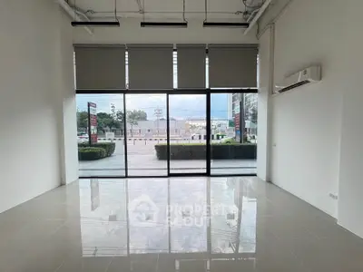 Spacious commercial space with large windows and modern interior design